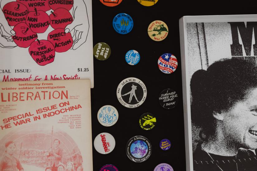 An image displaying memorabilia and pins from the 70s
