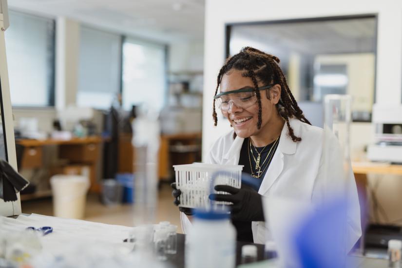A woman looking at samples in a lab